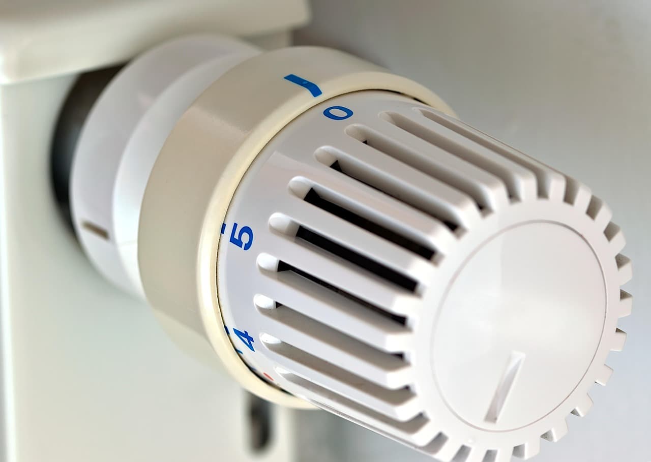 Close-up of a white thermostatic radiator valve head